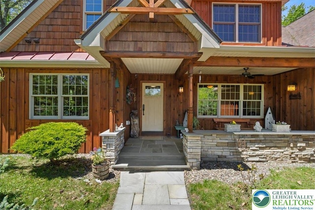 127 Timber Lake Dr, Barrett Twp, PA 18325 - view of exterior entry featuring board and batten siding and a ceiling fan