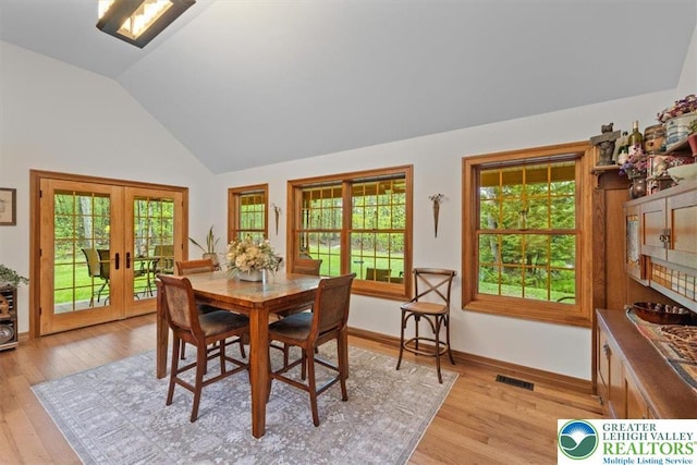 127 Timber Lake Dr, Barrett Twp, PA 18325 - dining room with vaulted ceiling, light wood-style flooring, french doors, and baseboards