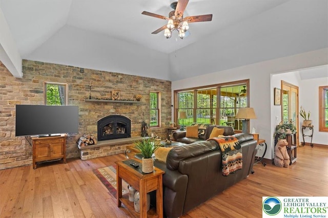 127 Timber Lake Dr, Barrett Twp, PA 18325 - living area featuring light wood-style flooring, healthy amount of natural light, lofted ceiling, ceiling fan, and a brick fireplace