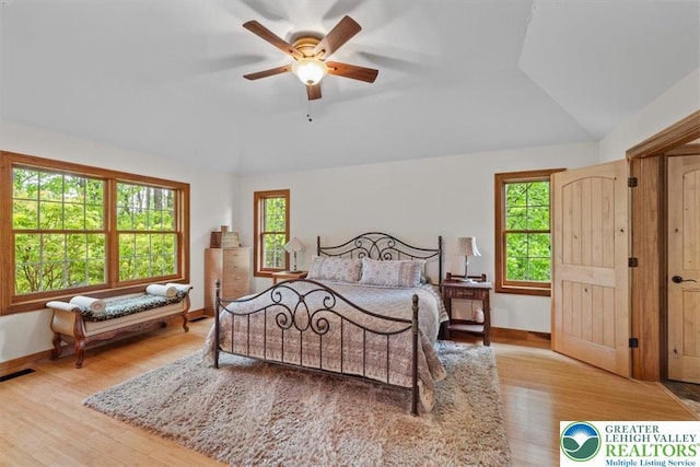 127 Timber Lake Dr, Barrett Twp, PA 18325 - bedroom with vaulted ceiling, wood finished floors, baseboards, and a ceiling fan