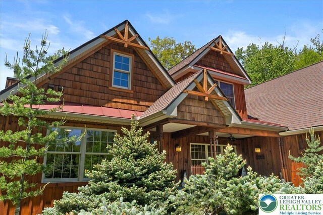 127 Timber Lake Dr, Barrett Twp, PA 18325 - craftsman house with roof with shingles and board and batten siding