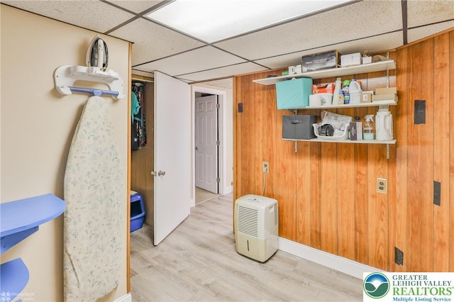 6386 Sullivan Trl, Plainfield Twp, PA 18091 - basement featuring a drop ceiling, wood finished floors, and wood walls