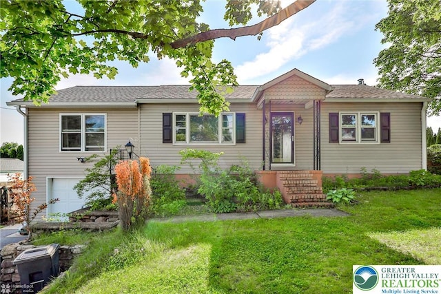 6386 Sullivan Trl, Plainfield Twp, PA 18091 - view of front facade with a front lawn and a garage