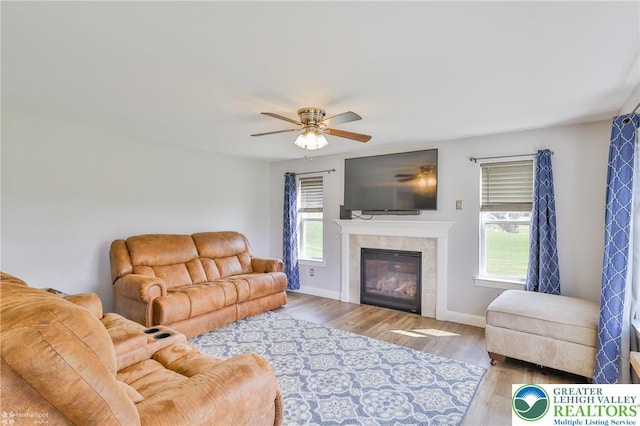 217 E Dell Rd, Moore Twp, PA 18014 - living room featuring wood finished floors, a fireplace, ceiling fan, and baseboards