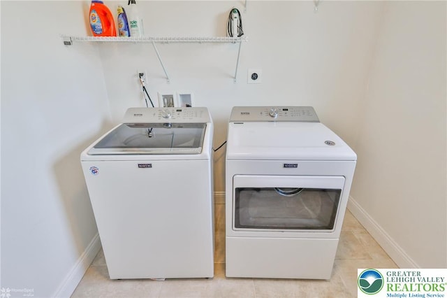 217 E Dell Rd, Moore Twp, PA 18014 - laundry area with washer and dryer, baseboards, and light tile patterned floors