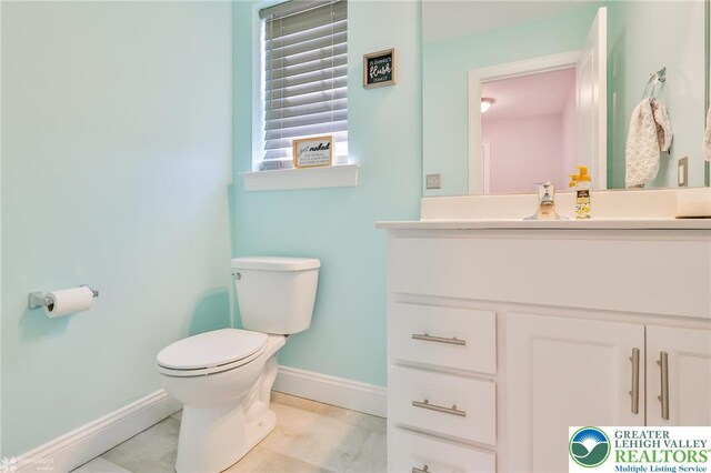 217 E Dell Rd, Moore Twp, PA 18014 - bathroom with baseboards, toilet, vanity, and tile patterned flooring