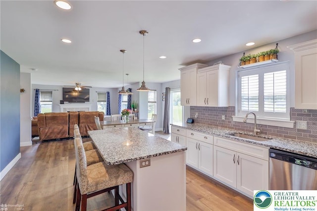 217 E Dell Rd, Moore Twp, PA 18014 - kitchen with stainless steel dishwasher, a sink, white cabinetry, a center island, and recessed lighting
