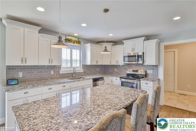 217 E Dell Rd, Moore Twp, PA 18014 - kitchen featuring stainless steel appliances, a sink, white cabinetry, backsplash, and recessed lighting