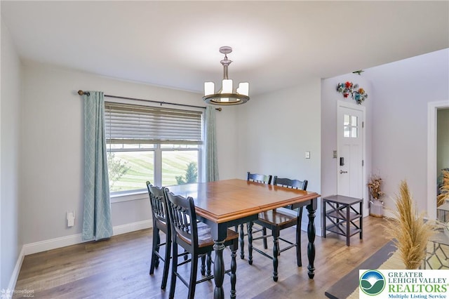 217 E Dell Rd, Moore Twp, PA 18014 - dining space featuring healthy amount of natural light, baseboards, and wood finished floors