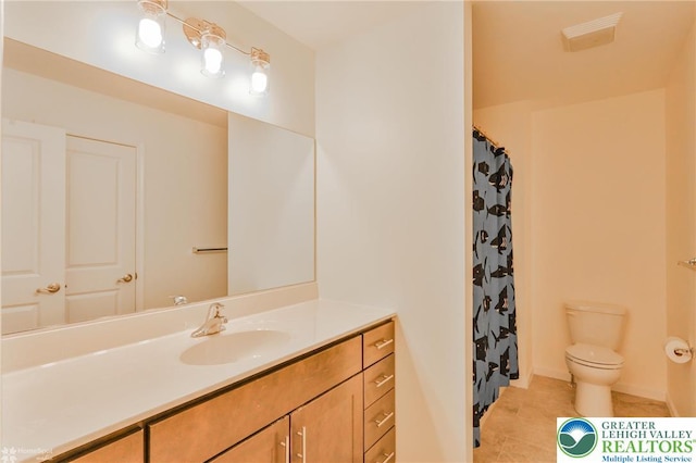 217 E Dell Rd, Moore Twp, PA 18014 - full bath featuring toilet, vanity, tile patterned floors, and a shower with curtain