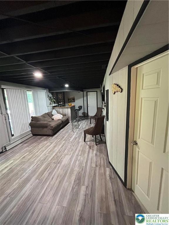 226 E Walnut St, Allentown City, PA 18109 - living area featuring wood finished floors and a baseboard heating unit