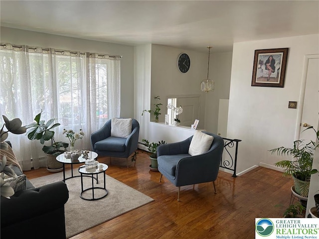 226 E Walnut St, Allentown City, PA 18109 - living room featuring wood finished floors, baseboards, and a baseboard radiator
