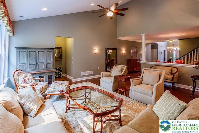 1069 Resolution Dr, Bethlehem City, PA 18017 - living room featuring decorative columns, a chandelier, high vaulted ceiling, a ceiling fan, and stairs