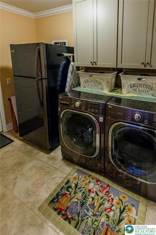 1069 Resolution Dr, Bethlehem City, PA 18017 - laundry area with cabinet space, washing machine and clothes dryer, ornamental molding, and light tile patterned flooring