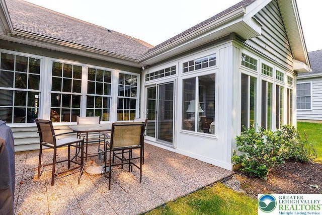 1069 Resolution Dr, Bethlehem City, PA 18017 - view of patio / terrace with outdoor dining space and a sunroom