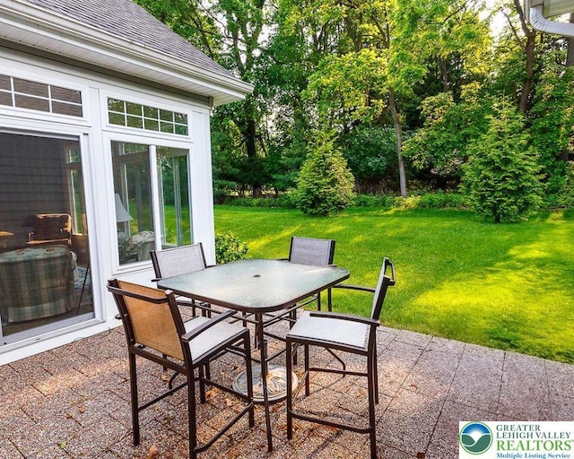 1069 Resolution Dr, Bethlehem City, PA 18017 - view of patio / terrace with outdoor dining area and a sunroom