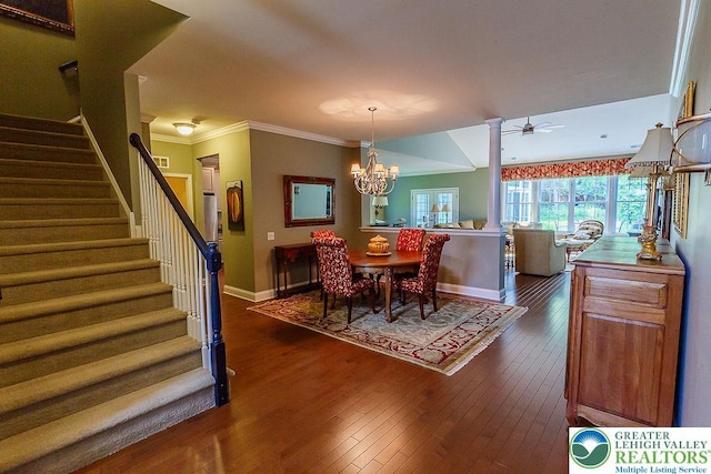 1069 Resolution Dr, Bethlehem City, PA 18017 - dining space with stairway, dark wood finished floors, a chandelier, ceiling fan, and crown molding