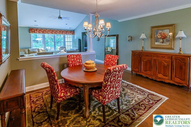 1069 Resolution Dr, Bethlehem City, PA 18017 - dining area featuring wood finished floors, a ceiling fan, a chandelier, vaulted ceiling, and crown molding