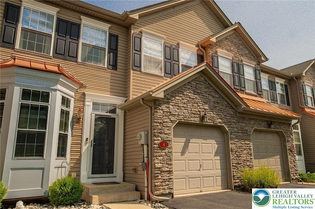 4 Hillside Ct, Easton, PA 18045 - view of property with stone siding, an attached garage, and driveway
