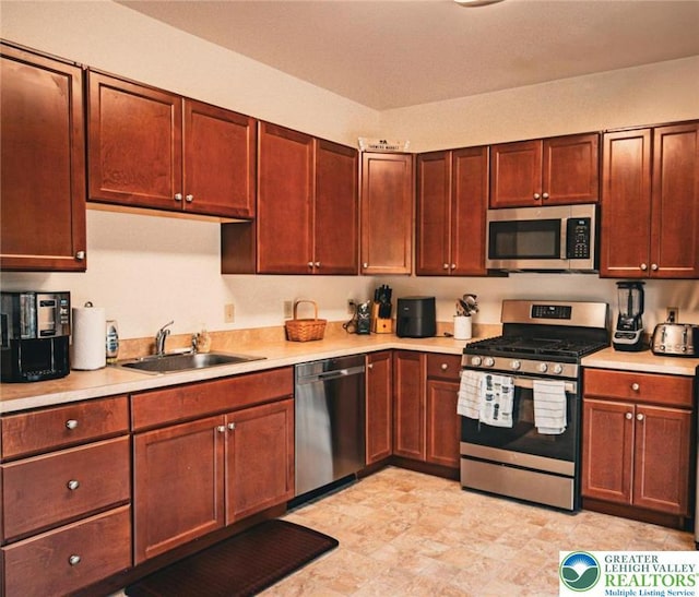 4 Hillside Ct, Easton, PA 18045 - kitchen featuring appliances with stainless steel finishes, a sink, and light countertops