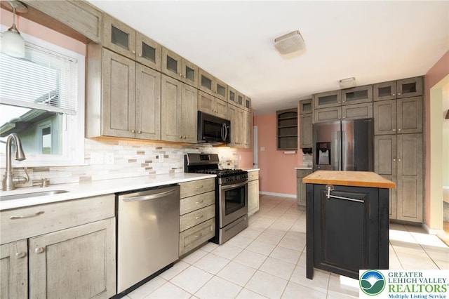 68 Knoll Cir, Boyertown, PA 19512 - kitchen with appliances with stainless steel finishes, a sink, butcher block counters, backsplash, and light tile patterned floors