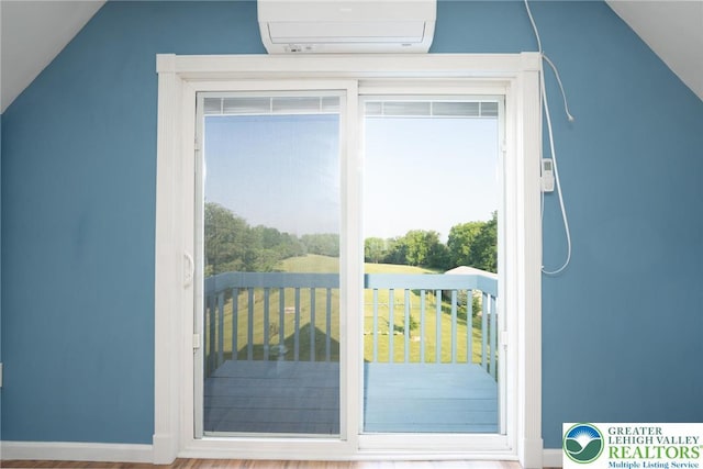 68 Knoll Cir, Boyertown, PA 19512 - doorway to outside with a wall mounted air conditioner, healthy amount of natural light, and lofted ceiling