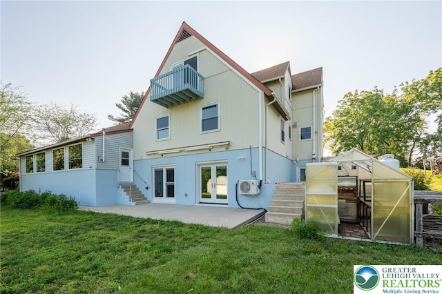 68 Knoll Cir, Boyertown, PA 19512 - back of house with a balcony, a greenhouse, french doors, and a lawn
