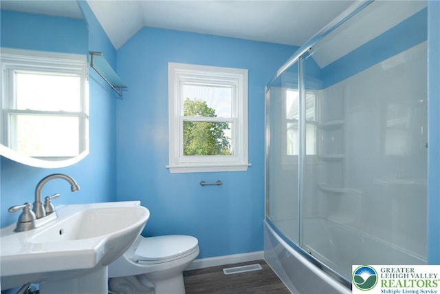 68 Knoll Cir, Boyertown, PA 19512 - full bathroom with toilet, a sink, baseboards, wood finished floors, and shower / bath combination with glass door