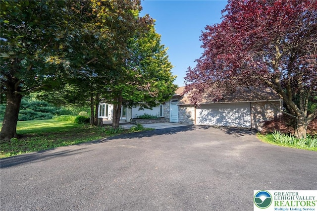 68 Knoll Cir, Boyertown, PA 19512 - obstructed view of property with driveway and a garage