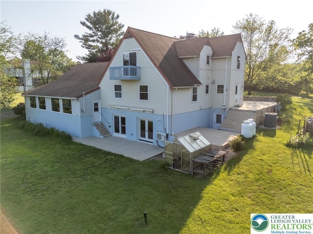 68 Knoll Cir, Boyertown, PA 19512 - rear view of property featuring roof with shingles, a patio, a balcony, and french doors
