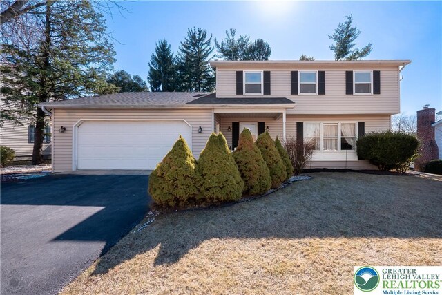 990 Hill Dr, Lower Macungie Twp, PA 18103 - view of front of home with an attached garage and asphalt driveway