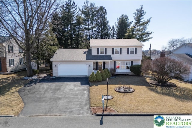 990 Hill Dr, Lower Macungie Twp, PA 18103 - view of front of home featuring asphalt driveway and a garage