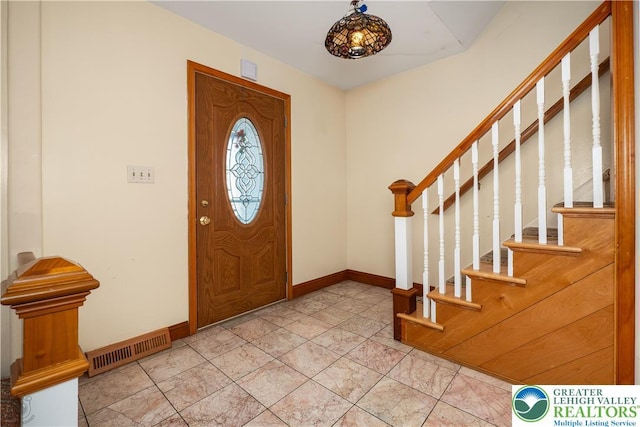 990 Hill Dr, Lower Macungie Twp, PA 18103 - foyer with stairway, baseboards, and light tile patterned floors
