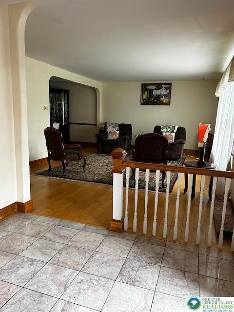 990 Hill Dr, Lower Macungie Twp, PA 18103 - living area featuring arched walkways and baseboards