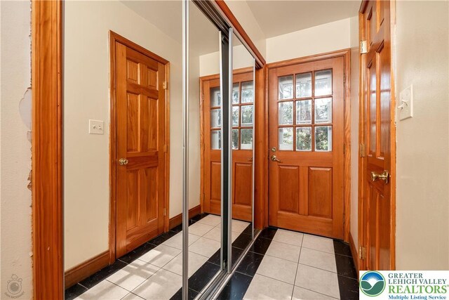990 Hill Dr, Lower Macungie Twp, PA 18103 - doorway with light tile patterned floors and baseboards
