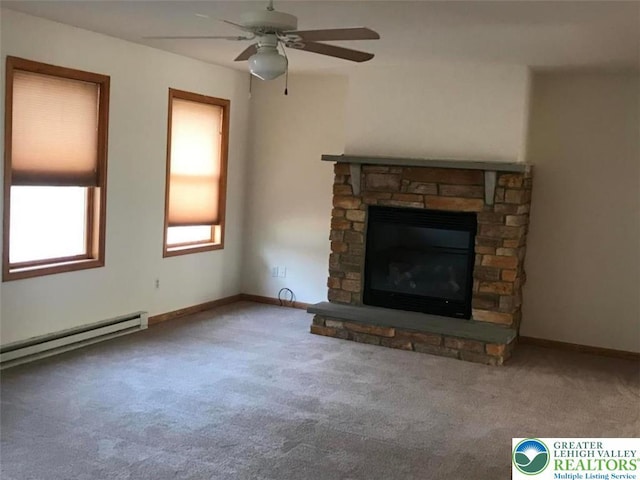 271 St Andrews Dr, Middle Smithfield Twp, PA 18324 - unfurnished living room featuring carpet, a baseboard heating unit, ceiling fan, a stone fireplace, and baseboards