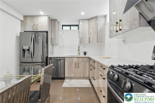 116 Peechatka, Pocono Twp, PA 18332 - kitchen with appliances with stainless steel finishes, a sink, light brown cabinetry, decorative backsplash, and light stone countertops