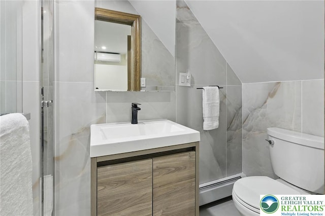 116 Peechatka, Pocono Twp, PA 18332 - bathroom with tile walls, baseboard heating, vanity, toilet, and lofted ceiling