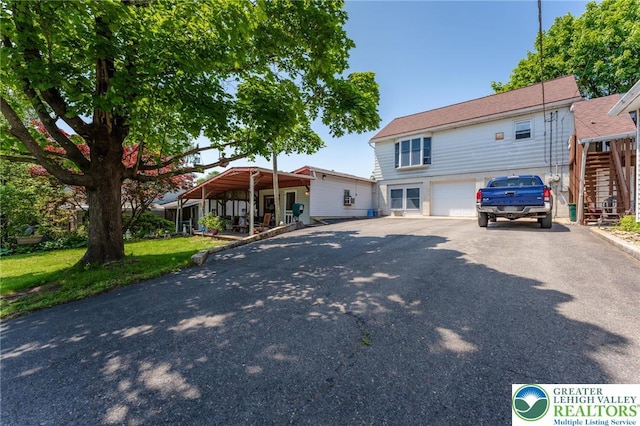 150 Lehigh St, Franklin Twp, PA 18235 - view of front facade featuring asphalt driveway, stairway, and an attached garage