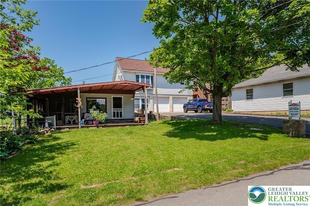150 Lehigh St, Franklin Twp, PA 18235 - back of property with asphalt driveway, a garage, and a lawn