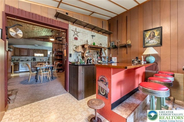 150 Lehigh St, Franklin Twp, PA 18235 - indoor dry bar with ceiling fan, freestanding refrigerator, carpet, and wooden walls