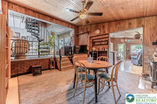 150 Lehigh St, Franklin Twp, PA 18235 - carpeted dining room with wood walls, a ceiling fan, stairway, and wood ceiling