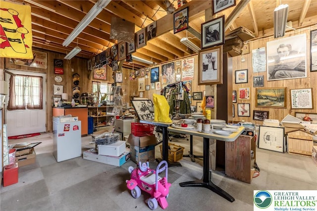 150 Lehigh St, Franklin Twp, PA 18235 - misc room with a workshop area, wood walls, and concrete floors