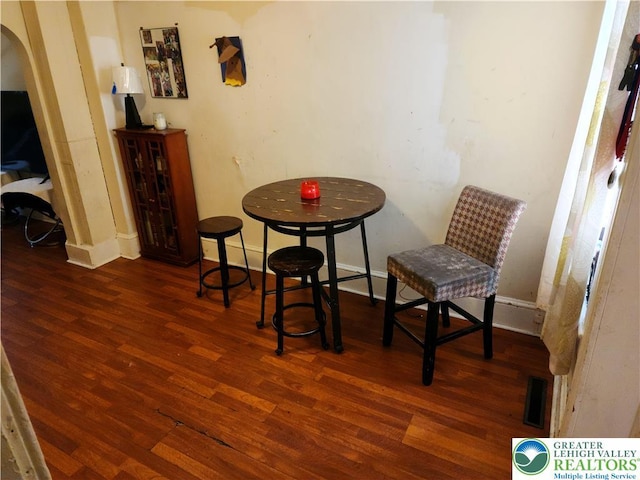 1016 Spruce St, Easton, PA 18042 - living area featuring wood finished floors, arched walkways, and baseboards