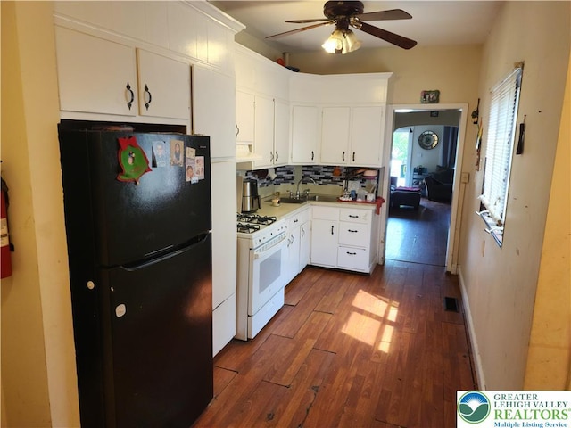 1016 Spruce St, Easton, PA 18042 - kitchen featuring freestanding refrigerator, white gas stove, a ceiling fan, dark wood-style floors, and range hood
