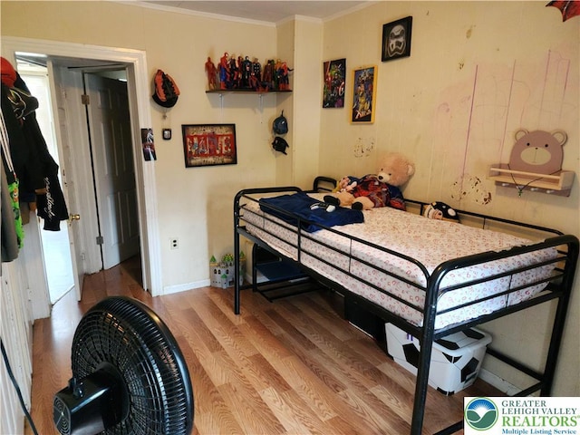 1016 Spruce St, Easton, PA 18042 - bedroom with wood finished floors, ornamental molding, and baseboards