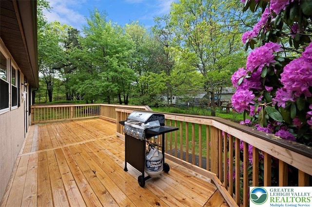 138 Drakes Dr, Penn Forest Twp, PA 18229 - deck featuring a grill and view of scattered trees
