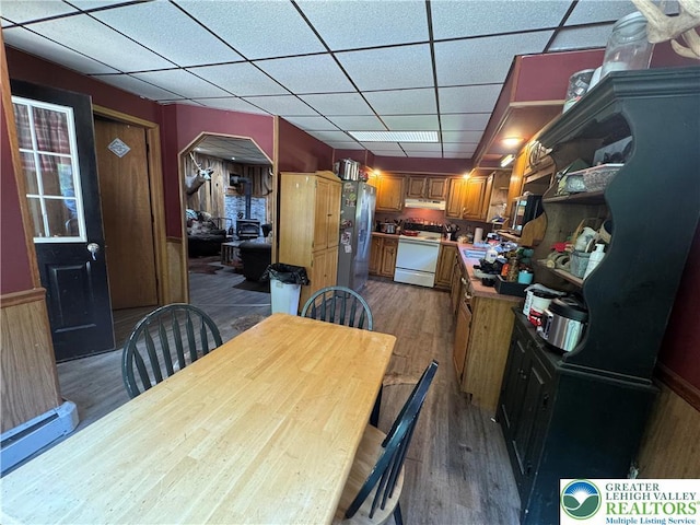 2330 Long Run Rd, Franklin Twp, PA 18235 - dining area featuring dark wood-type flooring, a paneled ceiling, and arched walkways