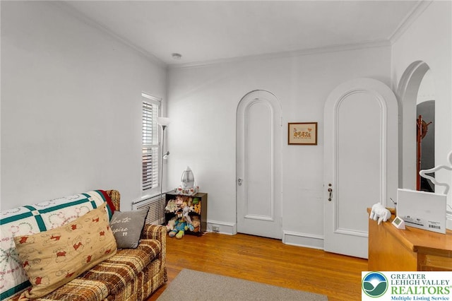 923 N Webster, Lackawanna, PA 18510 - living area featuring arched walkways, ornamental molding, and wood finished floors