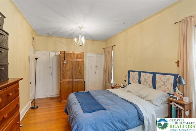 923 N Webster, Lackawanna, PA 18510 - bedroom with wood finished floors and a chandelier